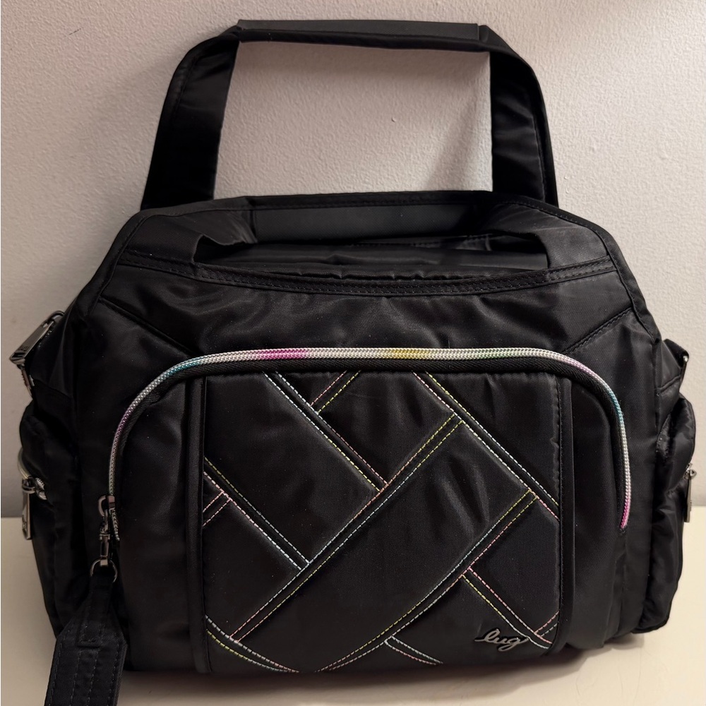 Lug “Rumbler” nylon satchel with a quilted front, colorful stitching and zipper.